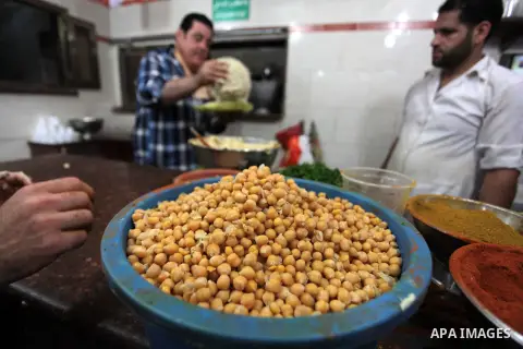 Palestinians prepare chickpeas known as hummus for breakfasting during the holy fasting month of Ramadan in Gaza city, on July 04, 2014. Muslims around the world refrain from eating, drinking and sexual intercourse from...