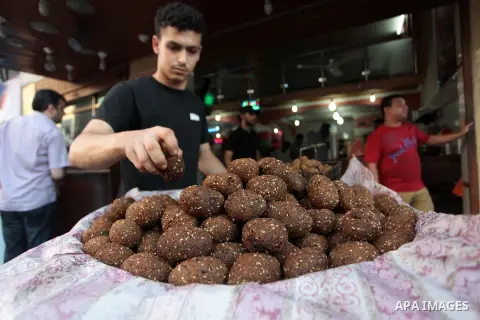 A Palestinian vendor prepares falafel during the holy fasting month of Ramadan in Gaza city, on July 0, 2014. Muslims around the world refrain from eating, drinking and sexual intercourse from dawn till dusk during Ramad...