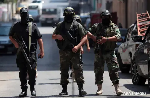 Palestinian militants of the Nasser Salah al-Din Brigades the military wing of the Popular Resistance Committees take part in a press conferenceon on cross-border escalation between Palestinians and Israel, in Gaza City...