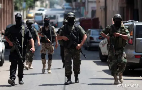 Palestinian militants of the Nasser Salah al-Din Brigades the military wing of the Popular Resistance Committees take part in a press conferenceon on cross-border escalation between Palestinians and Israel, in Gaza City...