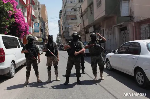 Palestinian militants of the Nasser Salah al-Din Brigades the military wing of the Popular Resistance Committees take part in a press conferenceon on cross-border escalation between Palestinians and Israel, in Gaza City...