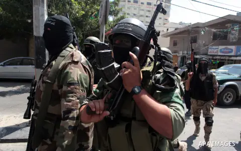 Palestinian militants of the Nasser Salah al-Din Brigades the military wing of the Popular Resistance Committees take part in a press conferenceon on cross-border escalation between Palestinians and Israel, in Gaza City...