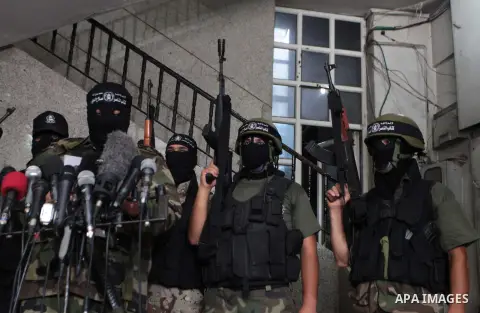 Palestinian militants of the Nasser Salah al-Din Brigades the military wing of the Popular Resistance Committees take part in a press conferenceon on cross-border escalation between Palestinians and Israel, in Gaza City...