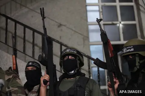 Palestinian militants of the Nasser Salah al-Din Brigades the military wing of the Popular Resistance Committees take part in a press conferenceon on cross-border escalation between Palestinians and Israel, in Gaza City...
