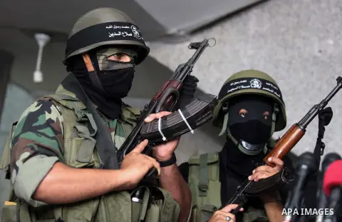 Palestinian militants of the Nasser Salah al-Din Brigades the military wing of the Popular Resistance Committees take part in a press conferenceon on cross-border escalation between Palestinians and Israel, in Gaza City...