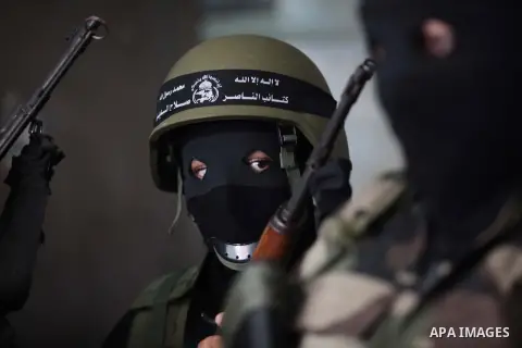 Palestinian militants of the Nasser Salah al-Din Brigades the military wing of the Popular Resistance Committees take part in a press conferenceon on cross-border escalation between Palestinians and Israel, in Gaza City...