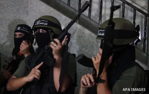 Palestinian militants of the Nasser Salah al-Din Brigades the military wing of the Popular Resistance Committees take part in a press conferenceon on cross-border escalation between Palestinians and Israel, in Gaza City...