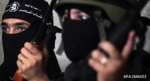 Palestinian militants of the Nasser Salah al-Din Brigades the military wing of the Popular Resistance Committees take part in a press conferenceon on cross-border escalation between Palestinians and Israel, in Gaza City...