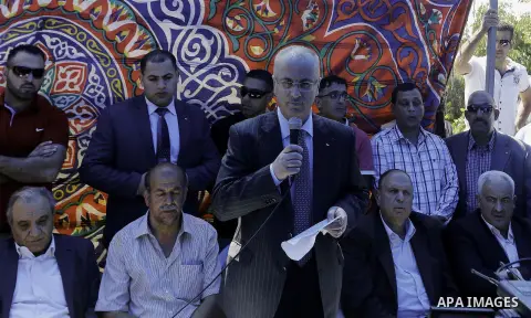 Palestinian Prime Minister Rami Hamdallah visits the mourning tent of Mohammed Abu Khder in Shuafat on July 06, 2014. Abu Khder, a Palestinian teenager was reportedly kidnapped and killed, triggering violent clashes in e...