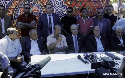 Palestinian Prime Minister Rami Hamdallah visits the mourning tent of Mohammed Abu Khder in Shuafat on July 06, 2014. Abu Khder, a Palestinian teenager was reportedly kidnapped and killed, triggering violent clashes in e...