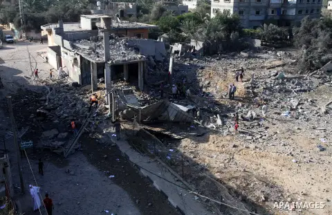 Palestinians inspect a house which police said was destroyed in an Israeli air strike in Khan Younis in the southern Gaza Strip July 8, 2014. Israel launched an offensive against Islamist Hamas in the Gaza Strip on Tuesd...