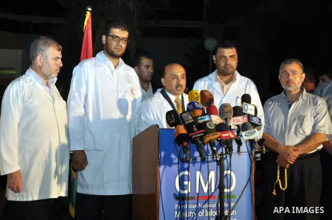 New Palestinian housing minister, Mofeed al-Hasaina speaks during a press conference at al-Shifa hospital, in Gaza City on July 8, 2014. Palestinian Health Ministry spokesman Ashraf al-Qedra said that more than 50 people...