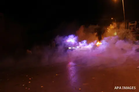 Palestinian youths clash with Israeli troops at the Beit Eil checkpoint near the West Bank city of Ramallah on July 09, 2014. At least 23 people were killed across Gaza, Palestinian officials said on Wednesday, by a bomb...