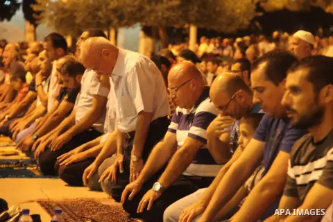 Palestinian muslim worshipers pray the night prayers at al-Aqsa mosque during the holy fasting month of Ramadan, in the Old City of Jerusalem, July 10, 2014. Muslims around the world refrain from eating, drinking and sex...