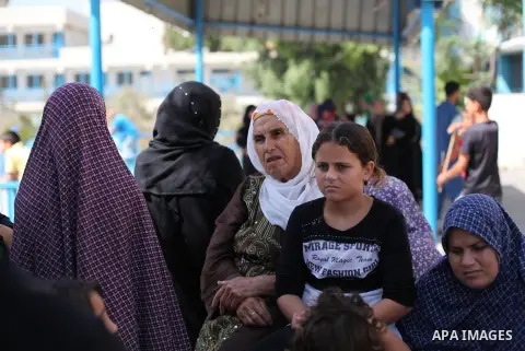 Palestinians, who fled their family homes in the northern border town of Beit Lahiya, stay at a United Nations-run school in Gaza City July 14, 2014. Israel appeared to hold off on a threatened escalation of its week-old...
