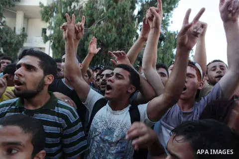 Palestinians carry the body of boys from the Baker family, whom medics said were killed by a shell fired by an Israeli naval gunboat, during their funeral in Gaza City July 16, 2014. Four Palestinian children were killed...
