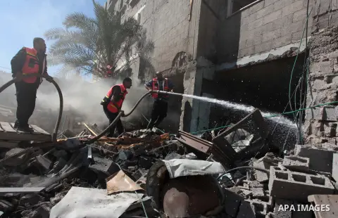 Palestinian firefighters extinguish a fire at a house destroyed during an Israeli strike, on July 16, 2014, in Gaza City. So far, Israel's campaign, now in its ninth day, has killed 214 Palestinians, with a Gaza-based ri...