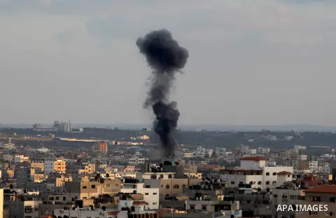Smoke billows from a building hit by an Israeli air strike in Gaza City on July 17, 2014. Israeli air strikes in Gaza killed four children, medics said, after a humanitarian lull in a 10-day conflict that has killed 237...