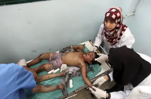 A Palestinian girl from al-Shaer family, who medics said was wounded after an Israeli air strike hit their house, receives treatment at a hospital in Khan Younis in the southern Gaza Strip July 20, 2014. The death toll i...
