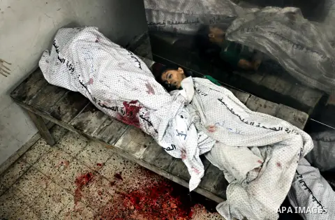 Bodies of Palestinian children are seen lie at the morgue of the al-Shifa hospital in Gaza City, on July 20, 2014 July 20, 2014. The death toll in Gaza passed 400 as Israel pressed its biggest offensive in the enclave in...