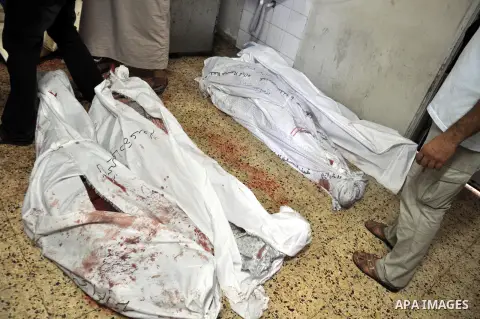 Palestinians inspect the bodies of their relatives at the morgue of the al-Shifa hospital in Gaza City, on July 20, 2014 July 20, 2014. The death toll in Gaza passed 400 as Israel pressed its biggest offensive in the enc...