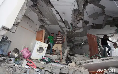 Palestinian rescuers search for bodies and survivors in the rubble of homes which were destroyed by an Israeli missile strike, in Gaza City, Monday, July 21, 2014. On Sunday, the first major ground battle in two weeks of...