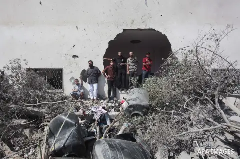 Palestinian rescue workers search for survivors under the rubble of a house was destroyed by an Israeli missile strike, in Gaza City, Monday, July 21, 2014. On Sunday, the first major ground battle in two weeks of Israel...