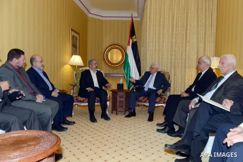 Palestinian president Mahmud Abbas meeting with the head of the political bureau of Hamas, Khaled Meshaal, in Doha, on July 20, 2014. Abbas is in Qatar to discuss a ceasefire with Hamas' leader Khaled Meshaal for the war...