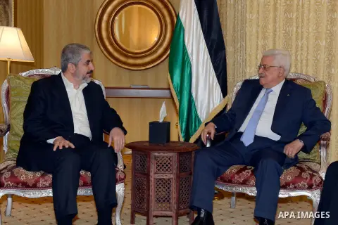 Palestinian president Mahmud Abbas meeting with the head of the political bureau of Hamas, Khaled Meshaal, in Doha, on July 20, 2014. Abbas is in Qatar to discuss a ceasefire with Hamas' leader Khaled Meshaal for the war...