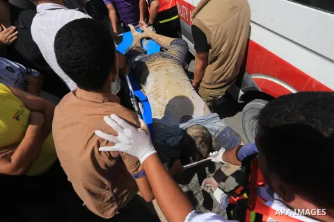 Mourners carry the body of a Palestinian from al-Sammouni family, who medics said was killed in an Israeli air strike, during their funeral in Gaza City July 21, 2014. Israeli forces killed at least 10 Palestinian milita...