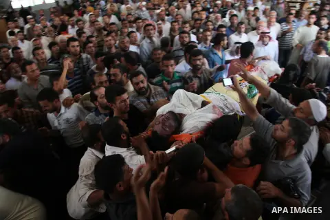 Palestinian mourners carry bodies of members Abu Jamaa family during the funeral for those killed in a three-storey house belonging to the Abu Jamaa family the day before following heavy Israeli bombardment, in Khan Yuni...
