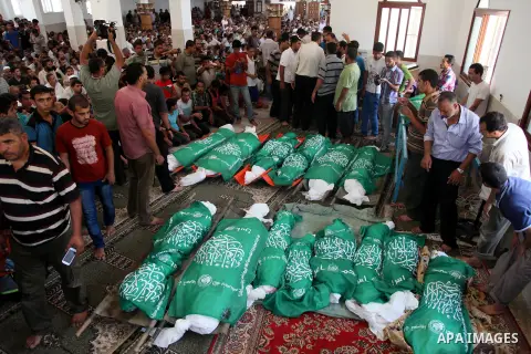 Palestinian mourners pray in a mosque during the funeral for those killed in a three-storey house belonging to the Abu Jamaa family the day before following heavy Israeli bombardment, in Khan Yunis, in the southern Gaza...