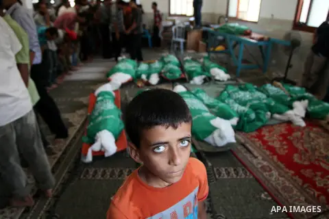 Palestinian mourners pray in a mosque during the funeral for those killed in a three-storey house belonging to the Abu Jamaa family the day before following heavy Israeli bombardment, in Khan Yunis, in the southern Gaza...