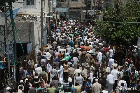 Palestinian mourners carry bodies of members Abu Jamaa family during the funeral for those killed in a three-storey house belonging to the Abu Jamaa family the day before following heavy Israeli bombardment, in Khan Yuni...