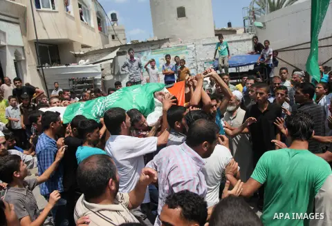Palestinian mourners carry bodies of members Abu Jamaa family during the funeral for those killed in a three-storey house belonging to the Abu Jamaa family the day before following heavy Israeli bombardment, in Khan Yuni...