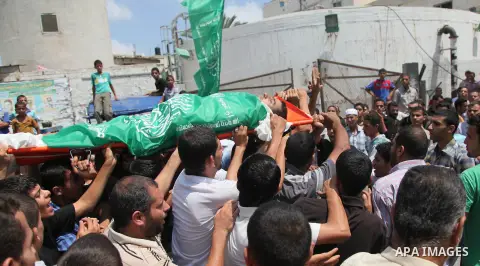 Palestinian mourners carry bodies of members Abu Jamaa family during the funeral for those killed in a three-storey house belonging to the Abu Jamaa family the day before following heavy Israeli bombardment, in Khan Yuni...