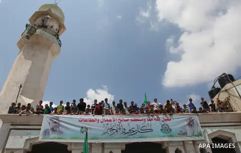 Palestinian mourners carry bodies of members Abu Jamaa family during the funeral for those killed in a three-storey house belonging to the Abu Jamaa family the day before following heavy Israeli bombardment, in Khan Yuni...
