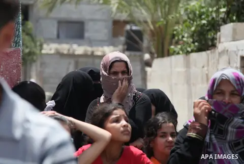 Palestinian mourners carry bodies of members Abu Jamaa family during the funeral for those killed in a three-storey house belonging to the Abu Jamaa family the day before following heavy Israeli bombardment, in Khan Yuni...