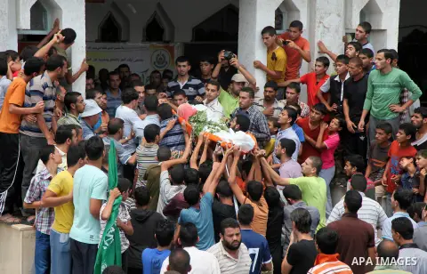 Palestinian mourners carry bodies of members Abu Jamaa family during the funeral for those killed in a three-storey house belonging to the Abu Jamaa family the day before following heavy Israeli bombardment, in Khan Yuni...