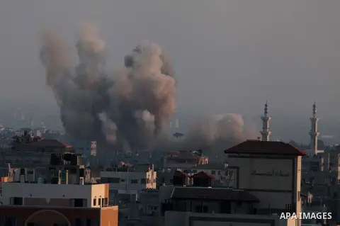 Smoke rises after an Israeli shelling at the Shijaiyah neighborhood in Gaza City, Gaza Strip, Monday, July 21, 2014. The top Hamas leader in the Gaza Strip signaled Monday that the Islamic militant group will not agree t...