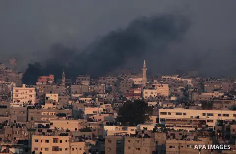 Smoke rises after an Israeli shelling at the Shijaiyah neighborhood in Gaza City, Gaza Strip, Monday, July 21, 2014. The top Hamas leader in the Gaza Strip signaled Monday that the Islamic militant group will not agree t...