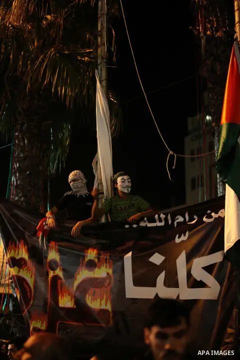 Palestinian protesters take part in a demonstration against Israel's military action and violence in the Gaza strip, in the West Bank City of Ramallah July 21, 2014. The Palestinian death toll in an Israeli offensive in...
