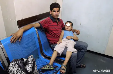 A Palestinian boy, who medics said was injured by Israeli shelling, receives treatment at al-Shifa hospital in Gaza City on July 21, 2014. The Palestinian death toll in an Israeli offensive in the Gaza Strip jumped to mo...