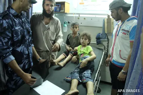 Palestinian children, who medics said were injured by Israeli shelling, receives treatment at al-Shifa hospital in Gaza City on July 21, 2014. The Palestinian death toll in an Israeli offensive in the Gaza Strip jumped t...