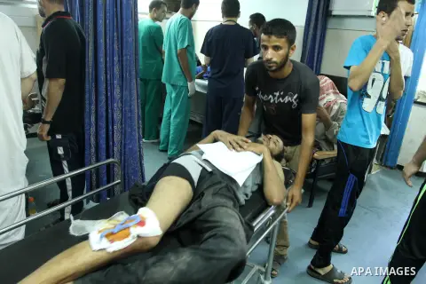 A Palestinian man, who medics said was injured by Israeli shelling, receives treatment at al-Shifa hospital in Gaza City on July 21, 2014. The Palestinian death toll in an Israeli offensive in the Gaza Strip jumped to mo...
