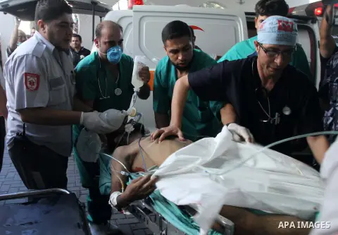 A Palestinian man, who medics said was injured by Israeli shelling, receives treatment at al-Shifa hospital in Gaza City on July 21, 2014. The Palestinian death toll in an Israeli offensive in the Gaza Strip jumped to mo...