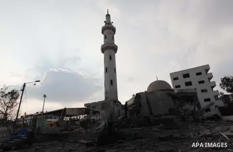 A Palestinian inspects damages at a mosque following an overnight Israeli military strike, on July 22, 2014 in Gaza City. UN chief Ban Ki-moon and US Secretary of State John Kerry are in Cairo today in a bid to broker a...