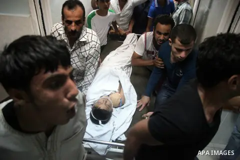 Relatives mourn the death of one Palestinian children from the Baker family, who was Injury by a shell fired by an Israeli naval gunboat, at the beach in Gaza Strip on July 16, 2014, Gaza City on July 22, 2014. Israel ke...