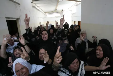 Palestinian female mourners grieve during the funeral of Mohammed al-Hamaida after he was killed in an Israeli air strike, on July 22, 2014, in Rafah town in the southern Gaza Strip. A series of Israeli air strikes early...