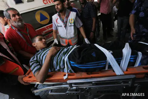 Palestinian man, who medics said was wounded by Israeli shelling, brought to a hospital in Gaza City July 23, 2014. Israeli forces pounded multiple sites across the Gaza Strip on Wednesday, including the enclave's sole p...